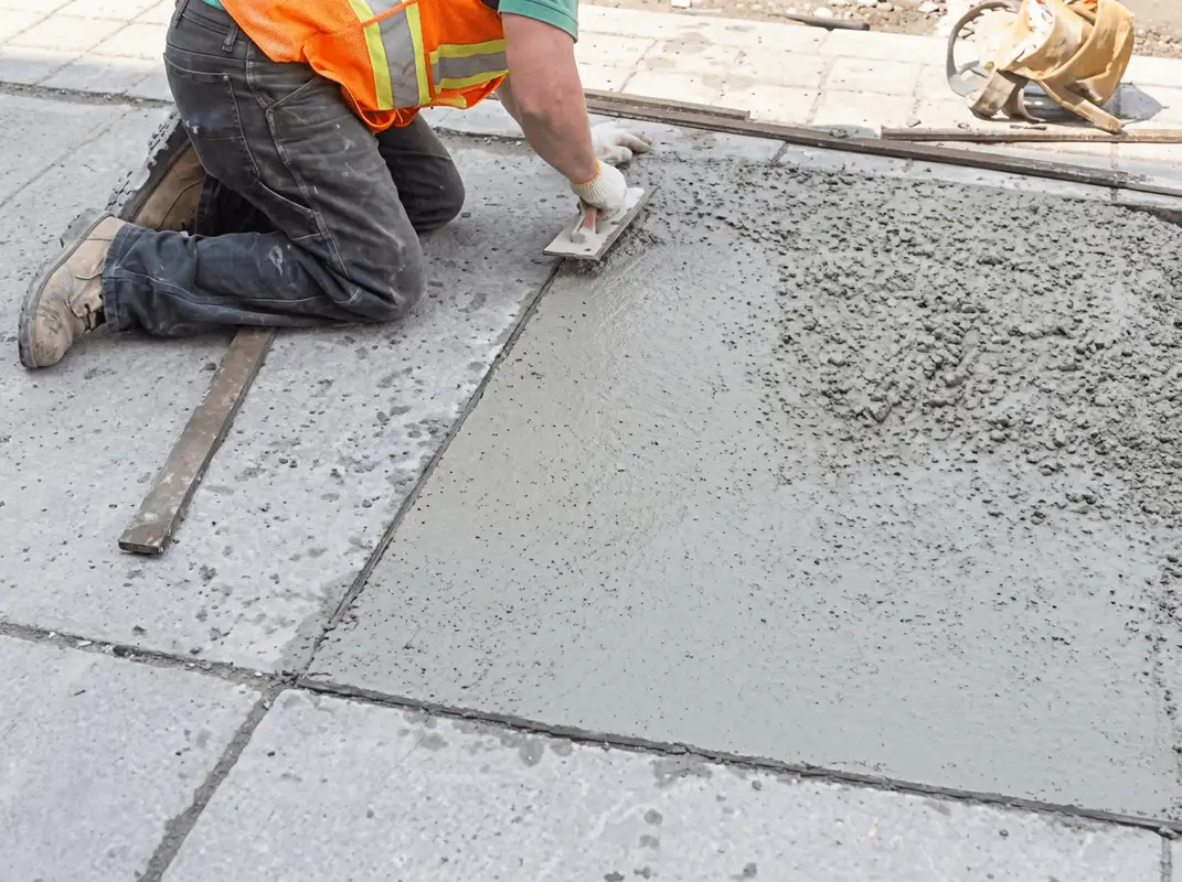 Professional repairing a concrete floor in Tempe, AZ